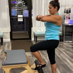 Dawn Pilates Studio Chesapeake - Our client demonstrating standing pumping beautifully on the Low Chair.