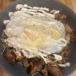 The Bleu Dog Cafe - Cajun hash, onions, peppers, cheese, egg.