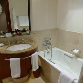 Four Seasons Hotel Sydney - Bathroom with sink and tub - Hotels Near Me - Sydney, NSW Four Seasons Hotel Sydney - Bathroom with sink and tub - Hotels Near Me - Sydney, NSW