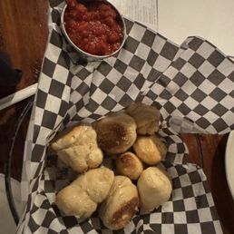 Garlic knots brought to table when we got here! Garlic knots brought to table when we got here!