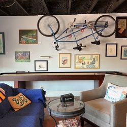 Tandem San Antonio - Shuffleboard and wall art behind one of the seating areas.