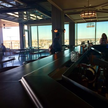 L.A. Jackson - The view to the patio from the bar. It's nice that you can enjoy the views no matter where you sit. - Cocktail Bars Near Me - Nashville, Tennessee