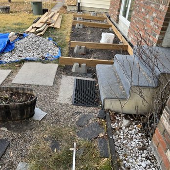 Elite Deck and Fencing - Incomplete composite deck in front yard - Decks & Railing Near Me - Calgary, Alberta