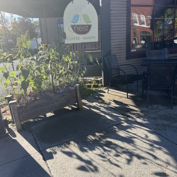 Nest Coffee & Bakery - Outdoor seating in the morning sun. - Coffee & Tea Near Me - Essex Junction, Vermont