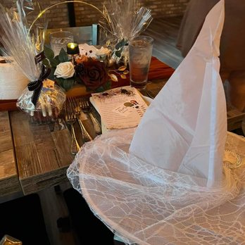 618 - a table setting with napkins and flowers - New American Near Me - Freehold Borough, New Jersey