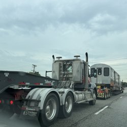 Dempster-Skokie - A very unusual sighting: 2 brand new CTA rail cars being transported on flat bed carriers on Dempster St.