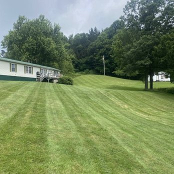 Grazing Goats Lawncare - a mobile home in the background - Lawn Services Near Me Grazing Goats Lawncare - a mobile home in the background - Lawn Services Near Me