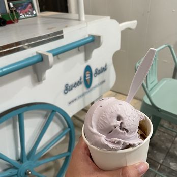 Sweet Saint - a hand holding a cup of ice cream - Ice Cream & Frozen Yogurt Near Me - New Orleans, Louisiana Sweet Saint - a hand holding a cup of ice cream - Ice Cream & Frozen Yogurt Near Me - New Orleans, Louisiana