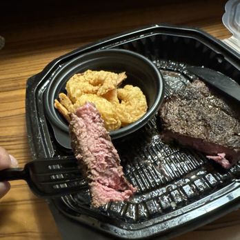 54th Street Scratch Grill & Bar - That is my "rare" flatiron steak. And "grilled shrimp." Taken 12 mins after ordering. - Bars Near Me - Saint Joseph, Missouri