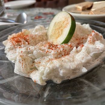 Hungarian Rhapsody - a plate of whipped cream with a lime slice on top - Hungarian Near Me - Southgate, Michigan