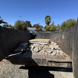 Bolen's Dump and Hauling Services - Loading up concrete and rocks for our clients after he removed a small patio area from his backyard.
