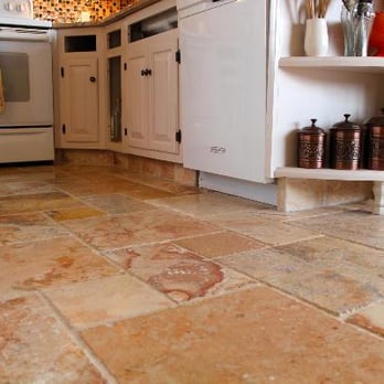 Big Bob's Flooring Outlet - a kitchen with white cabinets and a marble floor - Carpeting Near Me - Dayton, Ohio
