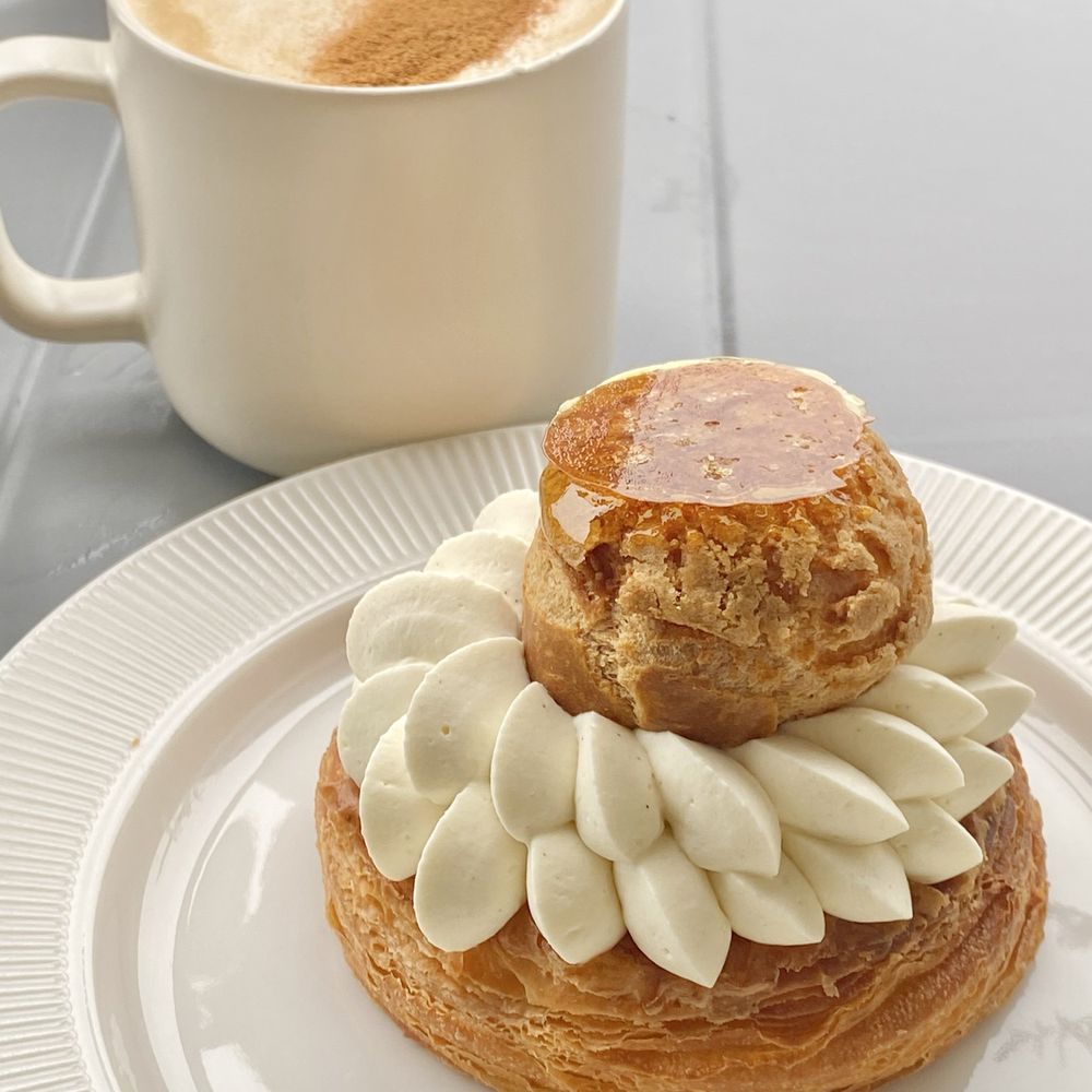 a pastry and a cup of coffee