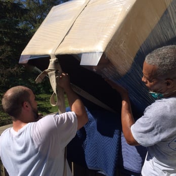 Economy Movers and Storage - And down it goes (safely, of course)! - Movers Near Me - Cranston, Rhode Island
