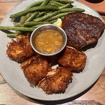 Outback Steakhouse - Sirloin with 4 coconut shrimp and the seasonal veggie. - Steakhouses Near Me - Concord, North Carolina Outback Steakhouse - Sirloin with 4 coconut shrimp and the seasonal veggie. - Steakhouses Near Me - Concord, North Carolina