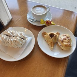 Mengue with Dulce de leche, café latte, ham and cheese empanada, lemon beef empanada