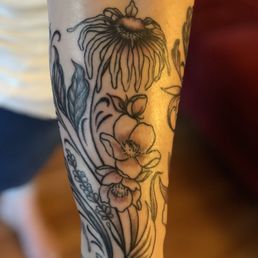 Amazing coneflower tattoo by Cheech. Amazing coneflower tattoo by Cheech.