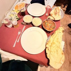 The Gurkha's Dine Nepalese & Indian Restaurant - Chicken and tikka and then a super spicy delicious dish. Garlic naan and regular