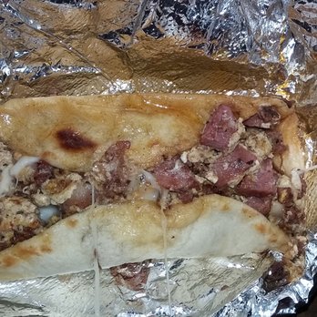 El Pollo Rico - Breakfast taco w/ eggs, cheese, sausage, bacon, and chorizo...so good! - Fast Food Near Me - Austin, Texas El Pollo Rico - Breakfast taco w/ eggs, cheese, sausage, bacon, and chorizo...so good! - Fast Food Near Me - Austin, Texas