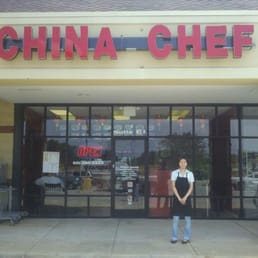 a woman standing in front of a restaurant
