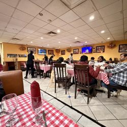 Taste Of Punjab - Inside with tables and booths
