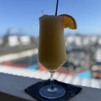 Barometer Waterfront Grill - Peach mango colada - Tiki Bars Near Me - Orange Beach, Alabama