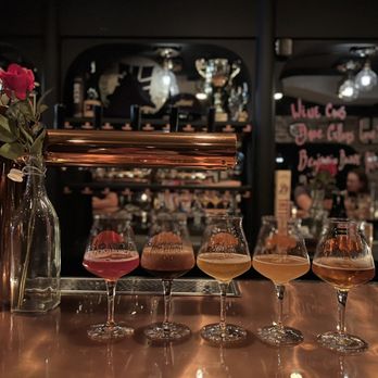 Proletariat - a row of wine glasses on a bar - Beer Bar Near Me - New York, New York