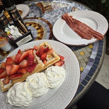Le Cafe De Paris - Waffles w Strawberries + Turkey Bacon - Coffee & Tea Near Me - Orlando, Florida Le Cafe De Paris - Waffles w Strawberries + Turkey Bacon - Coffee & Tea Near Me - Orlando, Florida