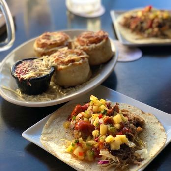 Kona Brewing - Happy hour menu: kalua pork taco with pineapple salsa, and pepperoni pizza rolls with marinara dipping sauce - Pubs Near Me - Honolulu, Hawaii Kona Brewing - Happy hour menu: kalua pork taco with pineapple salsa, and pepperoni pizza rolls with marinara dipping sauce - Pubs Near Me - Honolulu, Hawaii