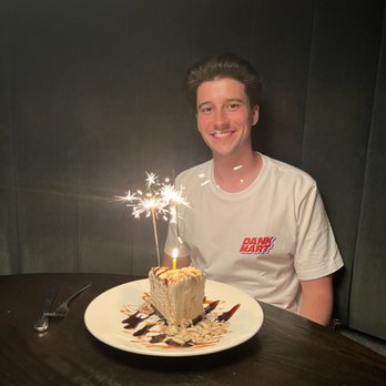 The Keg Steakhouse + Bar - Birthday Boy with Cake candle and sparklers - Steakhouses Near Me - Toronto, Ontario