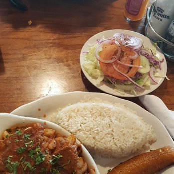 Cabana Latina - A single arroz con pollo (at the back) could feed 3 people! Front dish is the bistec encebollado -- plantain is from the arroz con pollo. - Latin American Near Me - Southampton, New York Cabana Latina - A single arroz con pollo (at the back) could feed 3 people! Front dish is the bistec encebollado -- plantain is from the arroz con pollo. - Latin American Near Me - Southampton, New York