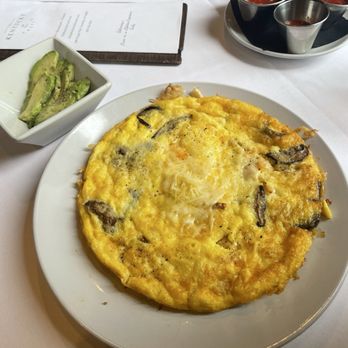 The Kentucky Castle - Open-Faced Omelet with a side of sliced avocado. - Hotels Near Me - Versailles, Kentucky The Kentucky Castle - Open-Faced Omelet with a side of sliced avocado. - Hotels Near Me - Versailles, Kentucky