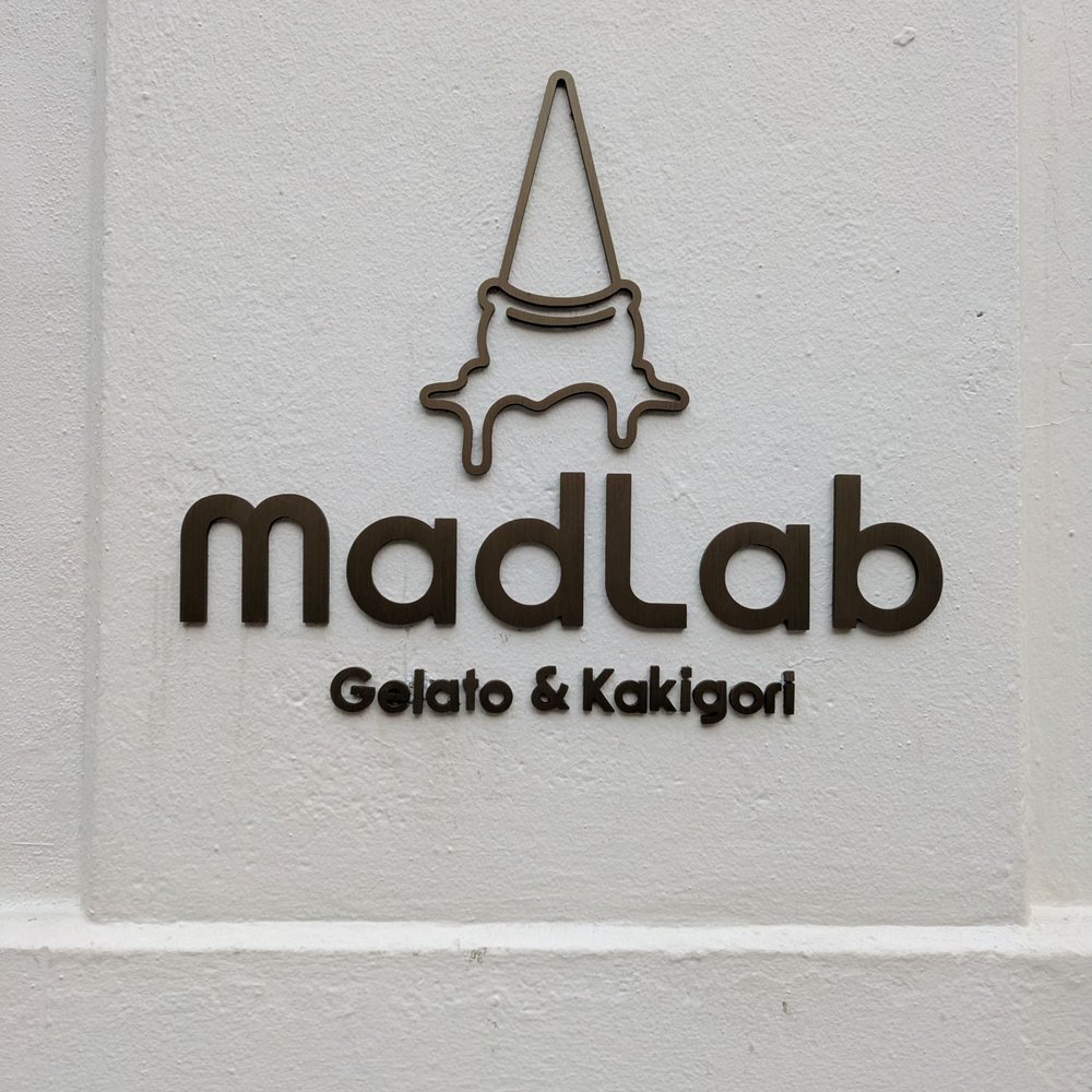 Look for the business name embedded on the wall.
