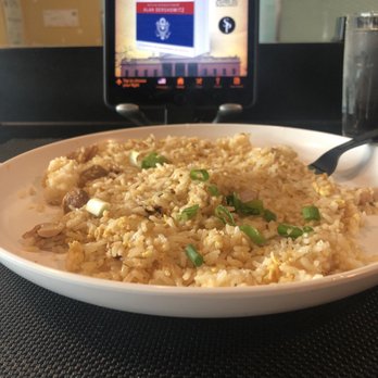 Bam Bam - Flat chicken fried rice, tiny portion and it was flatted down to make it look bigger. Note plastic fork because dishes weren't washed. - Vietnamese Near Me - Houston, Texas