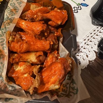 Wingstop - a basket of chicken wings on a table - Chicken Wings Near Me - Glen Ellyn, Illinois Wingstop - a basket of chicken wings on a table - Chicken Wings Near Me - Glen Ellyn, Illinois