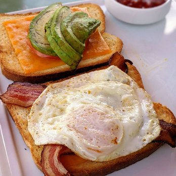 Rusty Pelican - Miami - Egg and bacon sandwich (comes with a side of fries) - Seafood Near Me - Key Biscayne, Florida Rusty Pelican - Miami - Egg and bacon sandwich (comes with a side of fries) - Seafood Near Me - Key Biscayne, Florida