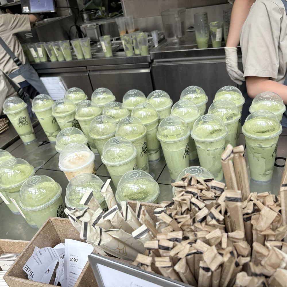 The sea of Triple Supreme Matcha Lattes on the counter The sea of Triple Supreme Matcha Lattes on the counter