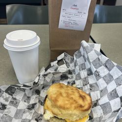 Bubba's Biscuit Barn - Sausage Egg and Cheese biscuit with a large coffee