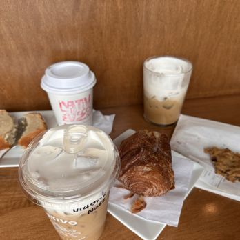 Nativo Cafe y Bodega - Lemon loaf, cruffin, chocolate chip cookie, and iced Nuez de Tejas coffee - Coffee & Tea Near Me - Fort Worth, Texas