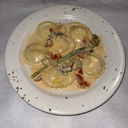 Lobster and spinach ravioli with mushroom cream sauce with mixed vegetables. Lobster and spinach ravioli with mushroom cream sauce with mixed vegetables.