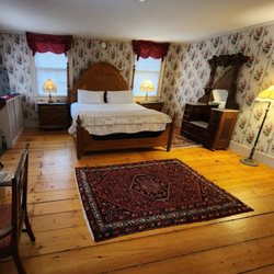 Arlington Inn & Spa - Pamela's Suite, king bed, sitting area with fireplace.