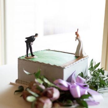 Shelby Lynns Cake Shoppe - a bride and groom on top of a wedding cake - Bakeries Near Me - Springdale, Arkansas