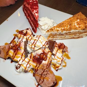 Churchill's - a plate of desserts on a table - American Near Me - Rockville Centre, New York