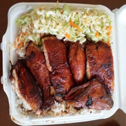 Jerk chicken with rice and peas and coleslaw