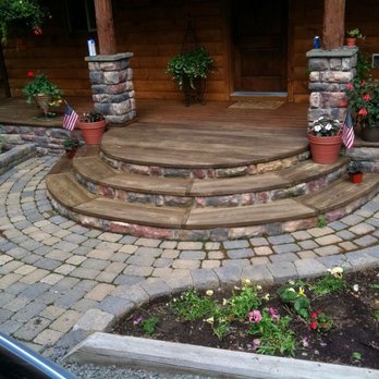 Elmore Enterprises - Entryway into a clients home. We also built a circular retaining wall for the same client and matched the color and type of stone. - Tree Services Near Me - Ithaca, New York Elmore Enterprises - Entryway into a clients home. We also built a circular retaining wall for the same client and matched the color and type of stone. - Tree Services Near Me - Ithaca, New York