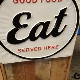 a sign that says, good food eat served here