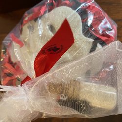 Cross River Pet Cremation - Paw print & little bottle with pets fur.