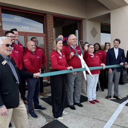Ribbon cutting event with Queen City Homestore team 2025.
