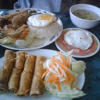 Pho Hoa Lao - Pork Chop/Fried chicken Combo (2 eggs on the side) with and order of Fried Egg Rolls - Vietnamese Near Me - Oakland, California Pho Hoa Lao - Pork Chop/Fried chicken Combo (2 eggs on the side) with and order of Fried Egg Rolls - Vietnamese Near Me - Oakland, California