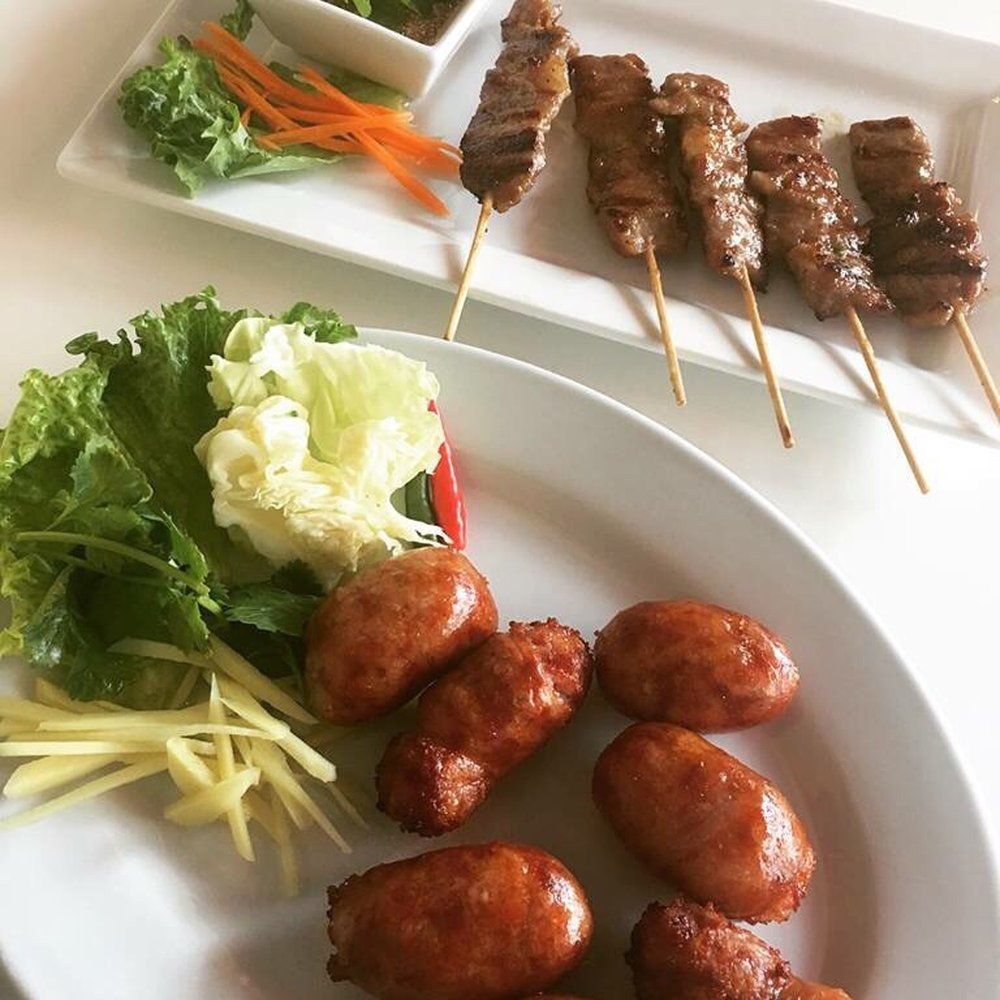 Tom Yum Cafe - The Moo Ping skewers are melt in your mouth goodness!! Their Isaan sausages are fire too. - Thai Near Me - Chicago, Illinois Tom Yum Cafe - The Moo Ping skewers are melt in your mouth goodness!! Their Isaan sausages are fire too. - Thai Near Me - Chicago, Illinois